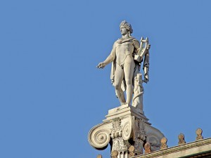 Greek God Apollo Statue on top of building